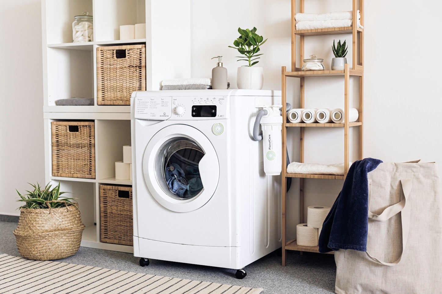 White front-load washing machine in a bright home laundry corner